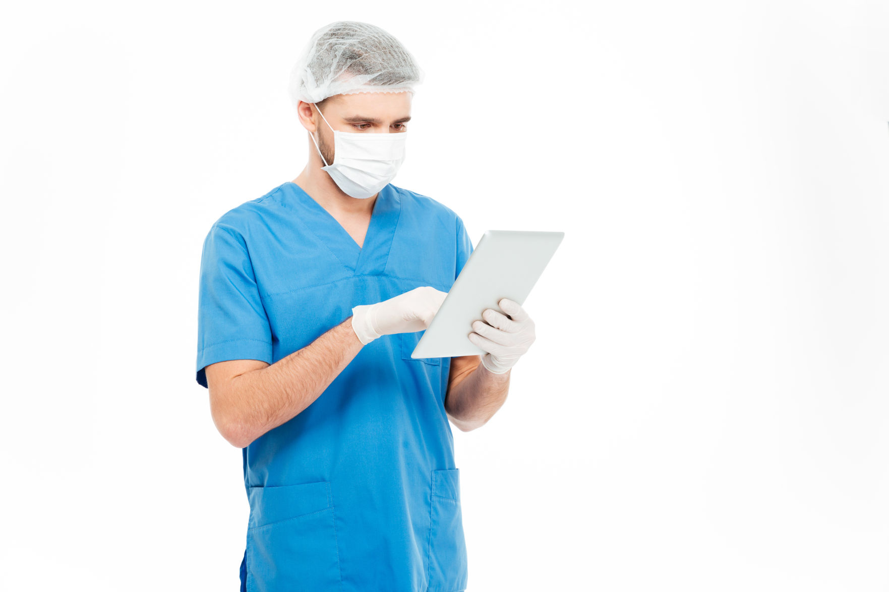 Male surgeon using tablet computer